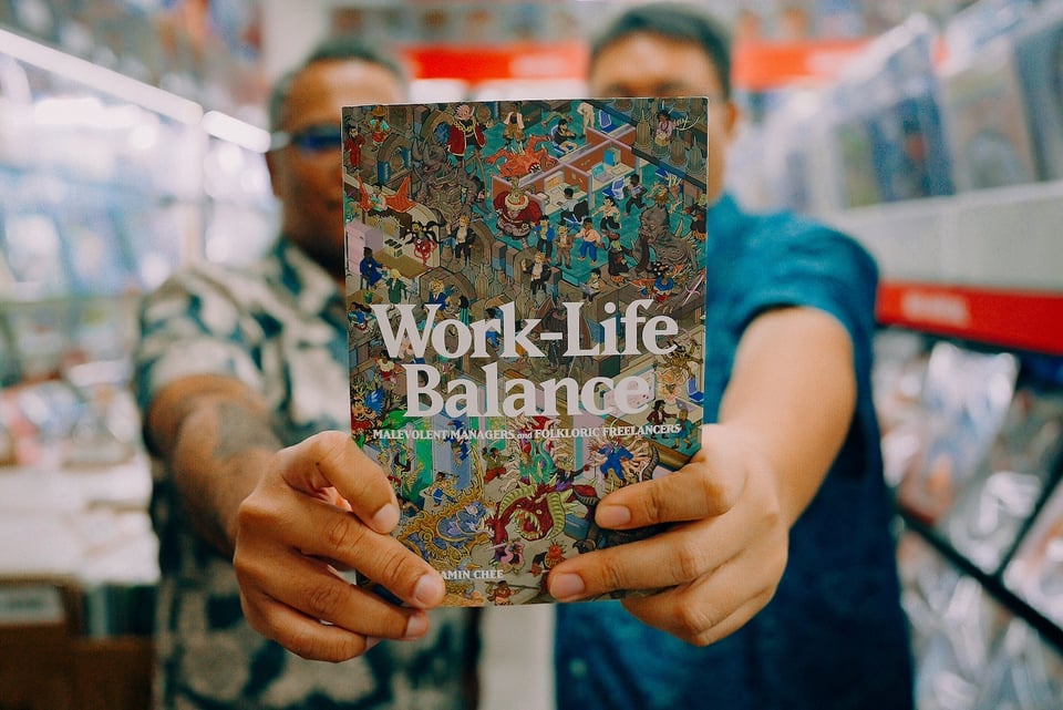 Ben and I holding up a copy of WORK-LIFE BALANCE