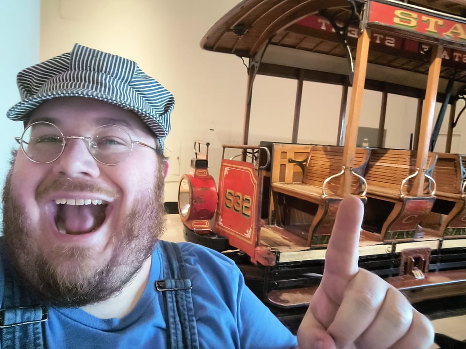 Me pointing at a streetcar