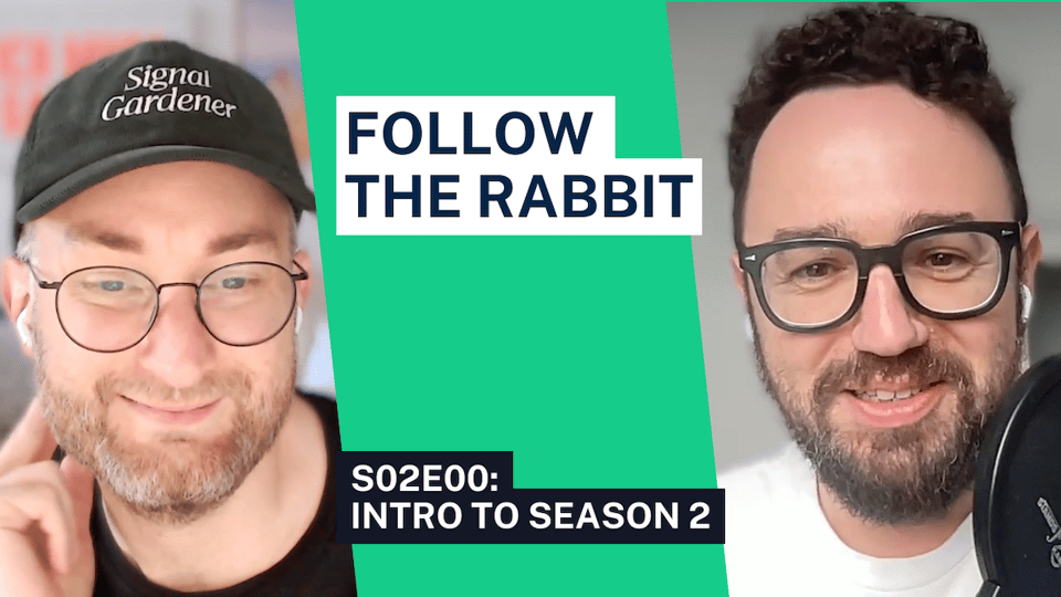 two men with glasses and the words follow the rabbit
