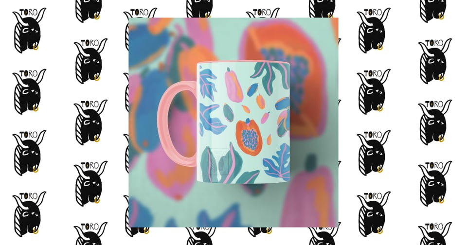 Image of a pink ceramic mug with a pink, orange, blue, and light turquoise papaya illustration- with handle facing left- on a colorful blurred background. Behind that image is a repeating pattern of the TORO logo on a white background.