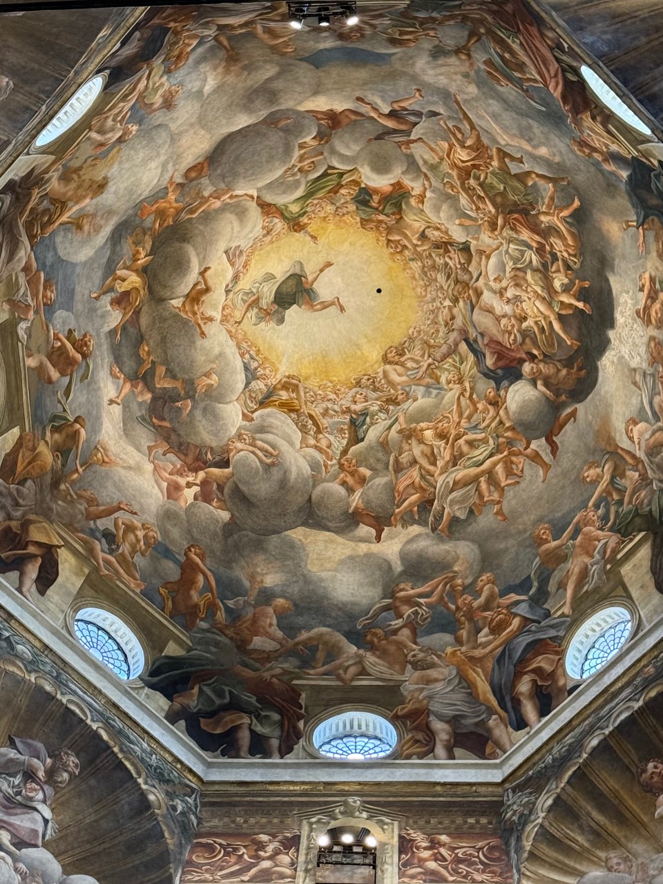 photo of Correggio's cupola painting of the Assumption of the Virgin in the Santa Maria Assunta Cathedral, showing all sorts of naked and semi-clothed bodies in the clouds as an angel is reaching down and Mary's getting ready to ascend