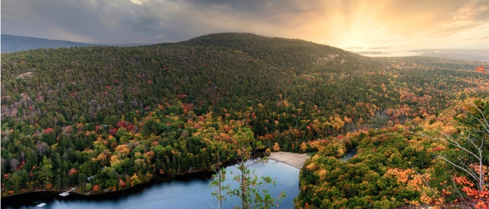 sunrise over a lake in the fall