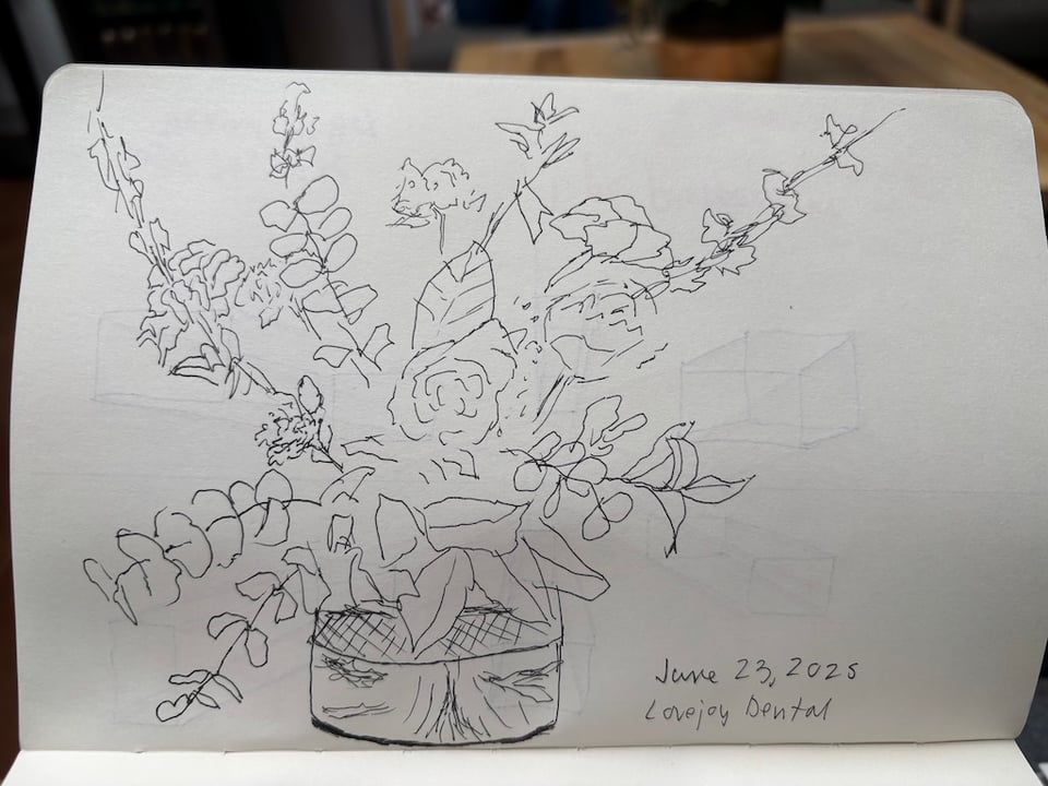 pen ink sketch of flowers in a vase