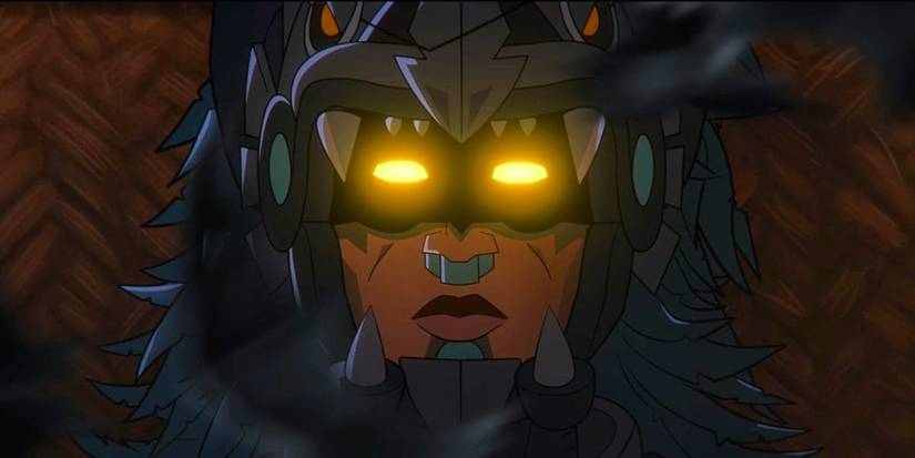 The dead body of Yohualli Coatl, Aztec Batman, lies on a woven rug, still in his Batman armor and wearing his stone nose ring and sublabial plate. You could be forgiven for thinking he's dead, given his eyes are shining bright yellow.
