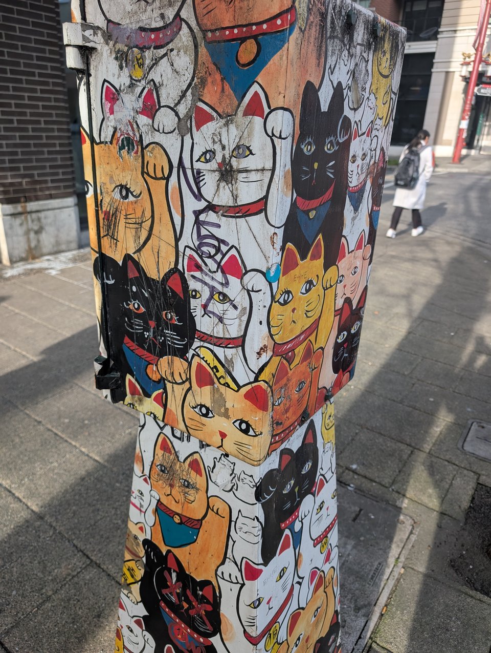Street art shows a host of fortune cats