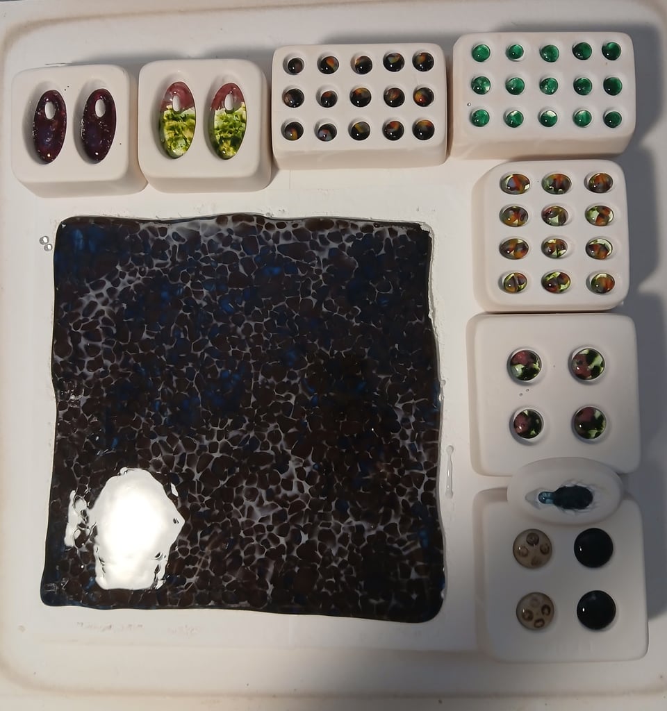 everything has fused nicely. the sheet is brown, white and green. the mushroom didn't have enough frit