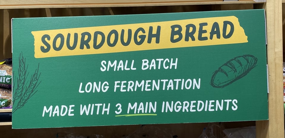 Grocery Store Sign: "Sourdough Bread, Small Batch, Long Fermentation, Made with 3 main ingredients"