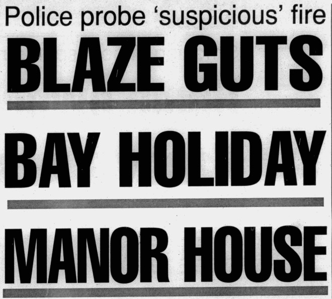 Front page headline reading "blaze guts bay holiday manor house" with a subhead of "Police probe 'suspicious' fire"