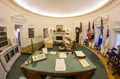 A fisheye lens view of a replica Oval Offiice.