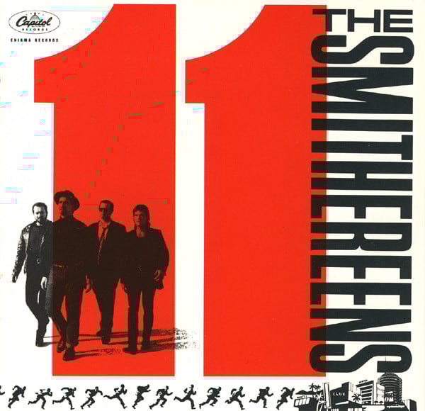A giant red "11" takes up most of the cover. Superimposed on the first 1 are the band, four white guys walking. Along the bottom is the silhouette of a running man, a series of positions like a zoetrope. He appears to be running towards pen and ink drawings of Las Vegas-style hotels. It only now occurs to me that maybe this is an oblique reference to the original OCEAN'S 11 film.