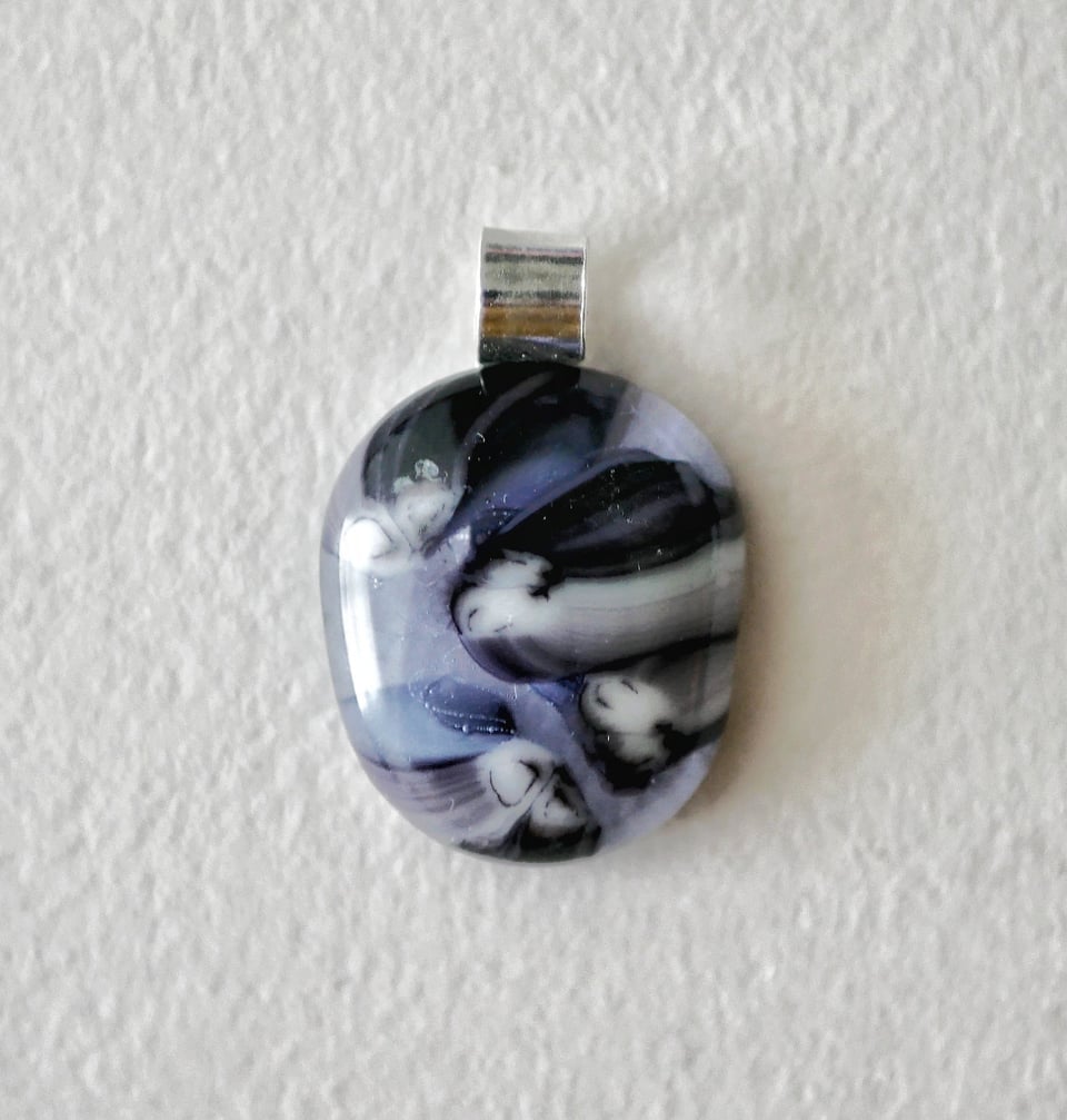 purple pendant with interesting streakiness and a layered effect from stacking transparents and opaques