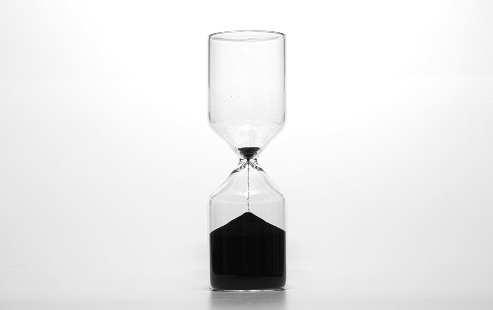 An hourglass, where there is very little sand left in the top. Photo by Wilhelm Gunkel on Unsplash