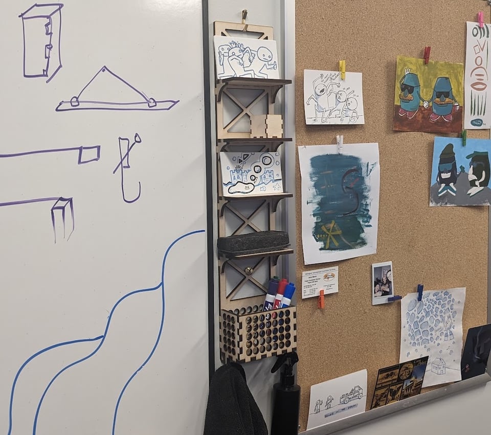 a bulletin board with drawings on it