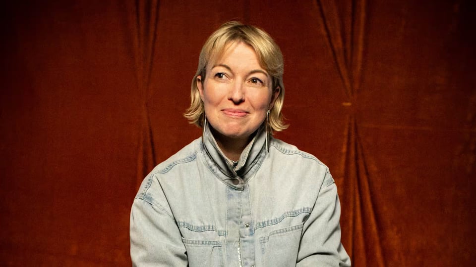 Hot Pizza founder Julia dault, in a denim shirt, against a red background
