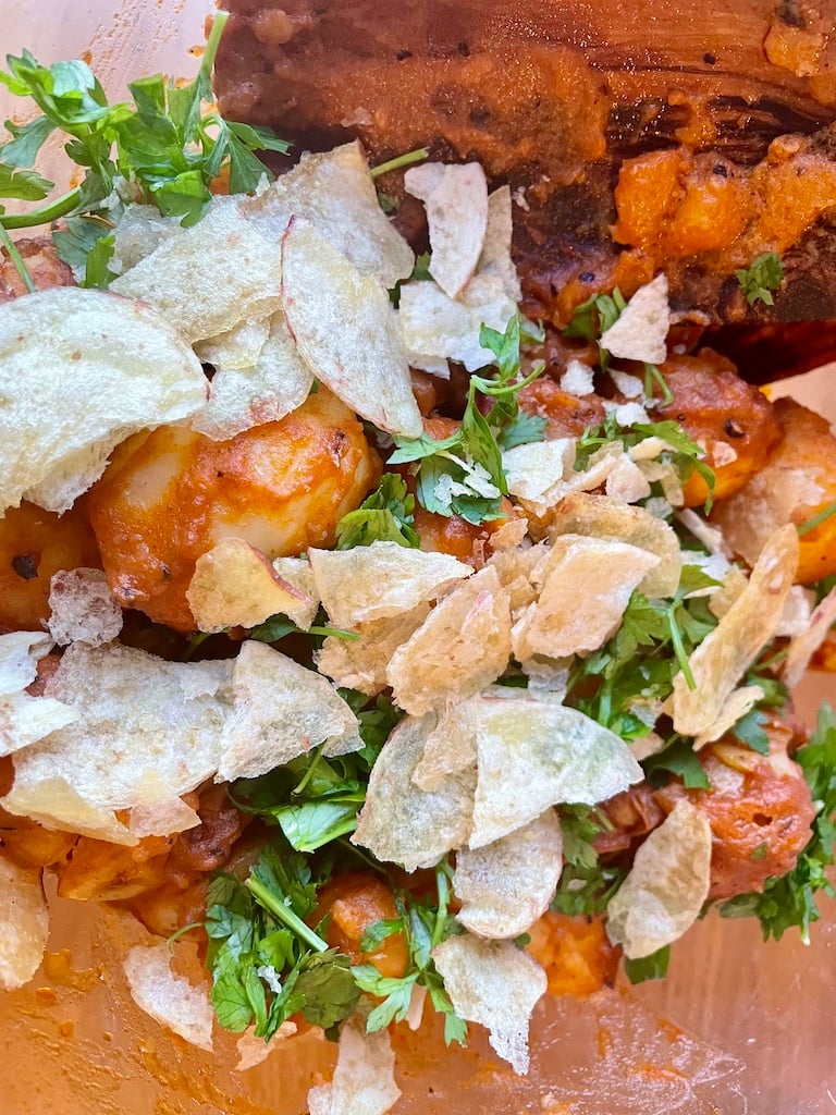 Crisps on a paprika potato salad