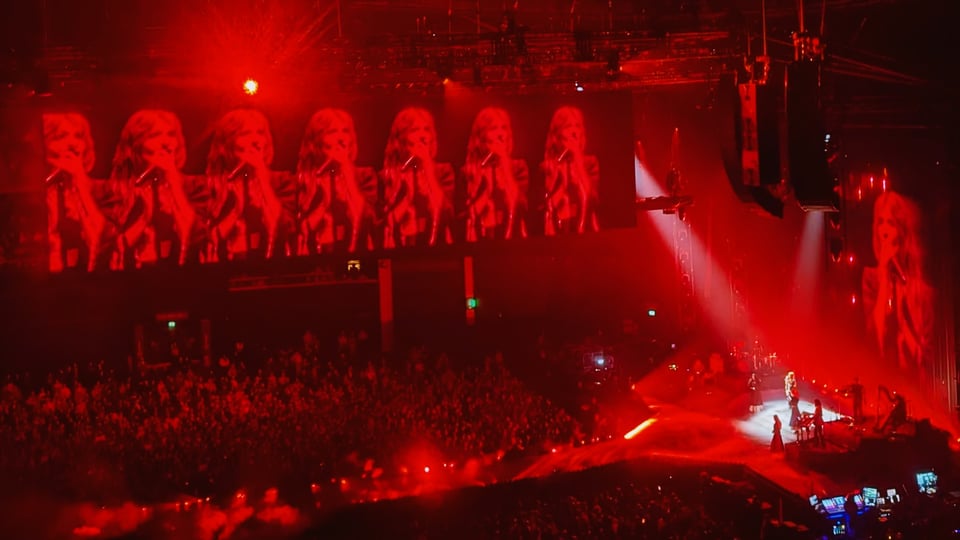 Florence and the Machine on stage taken from up in the stands. 7 florences in a row on the over stage screen.