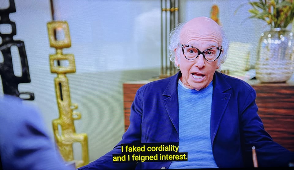 older balding white man wearing typically gendered female eyeglass and text reading I faked cordiality and I feigned interest