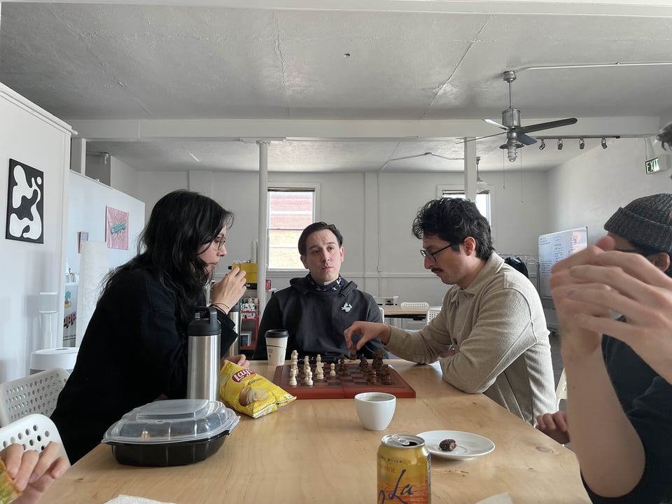 A game of chess being rudely interrupted.