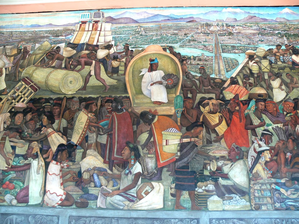 A mural painting by Diego Rivera showing a jumble of people buying and selling products like corn, tomatoes, squash, and reed mats in the Tlatelolco market. An elite person sits in an enclosed throne observing the bustle.