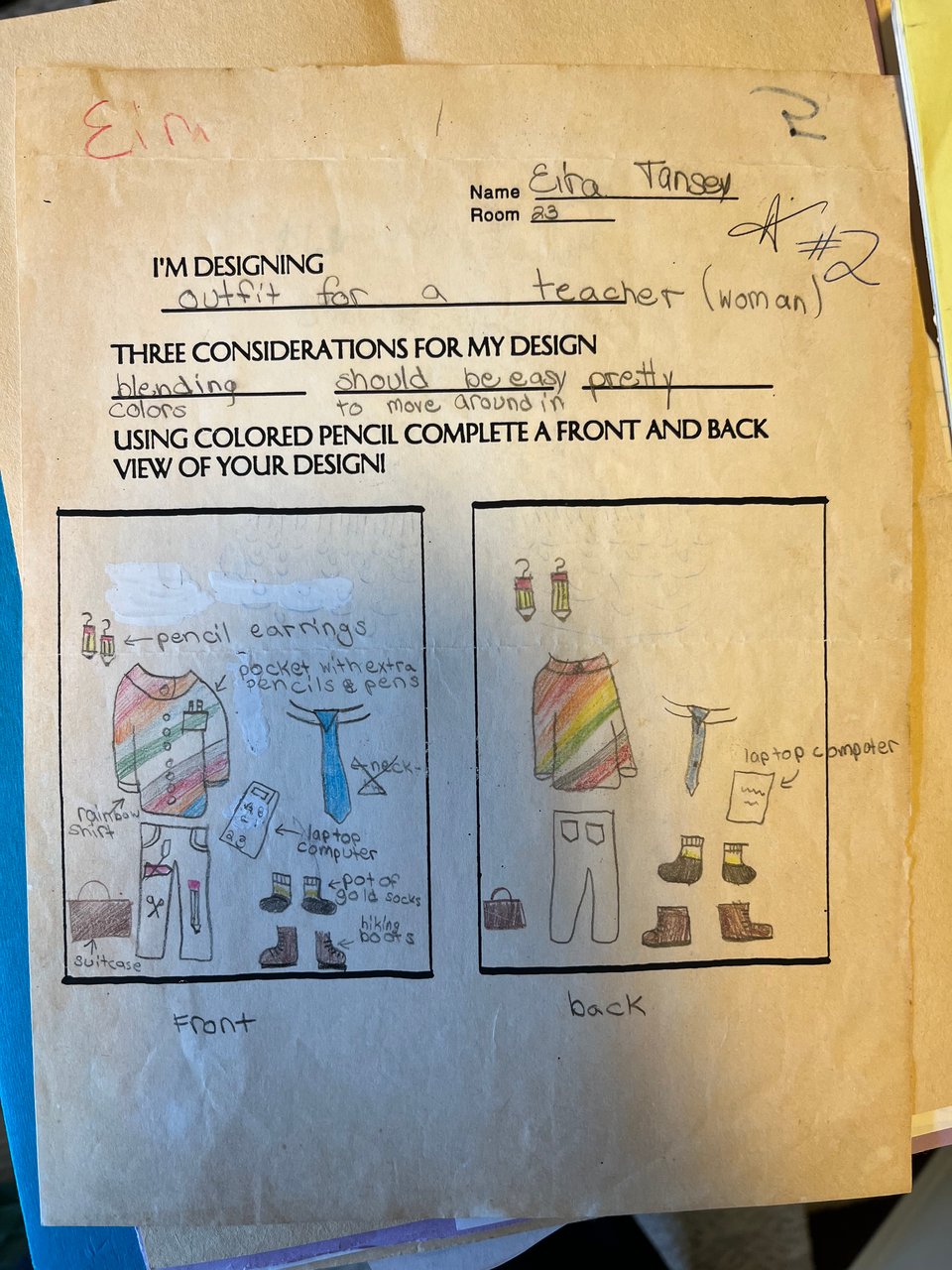A school assignment drawing made by Eira from her childhood depicting a "pretty" outfit for an art teacher that includes a rainbow shirt and hiking boots.