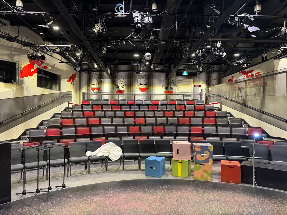 The interior of the Rapid Fire Theatre with stage blocks and light rig.