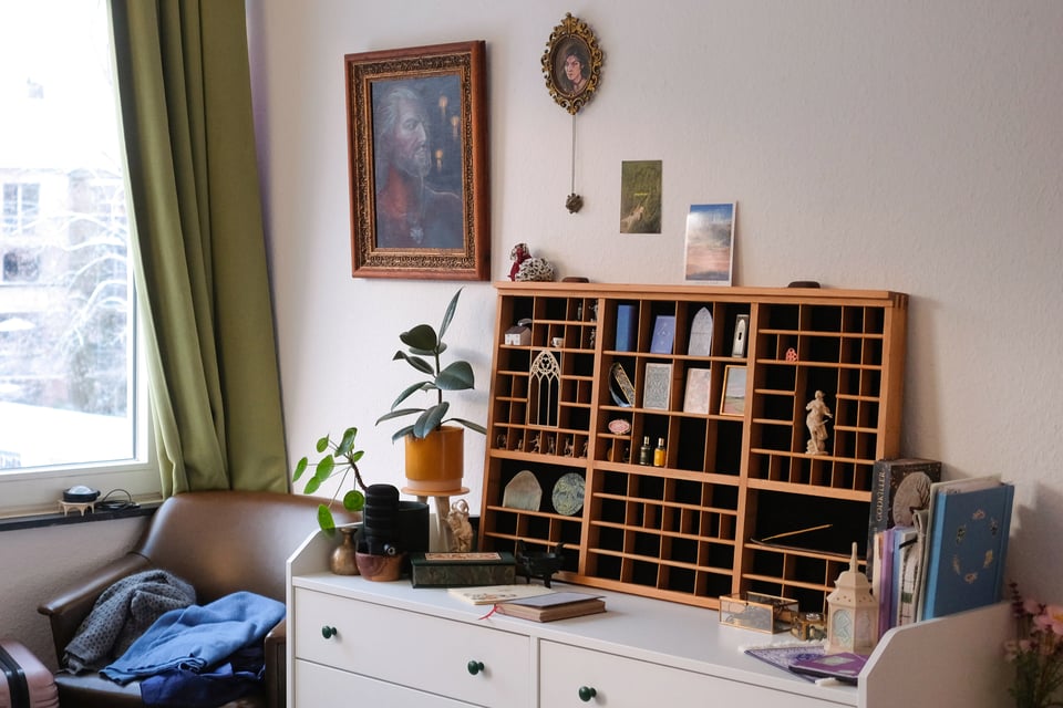 A photo of the trinket shelf and the dresser, viewed from the side.