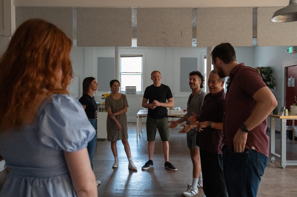 A group of people learning to dance.