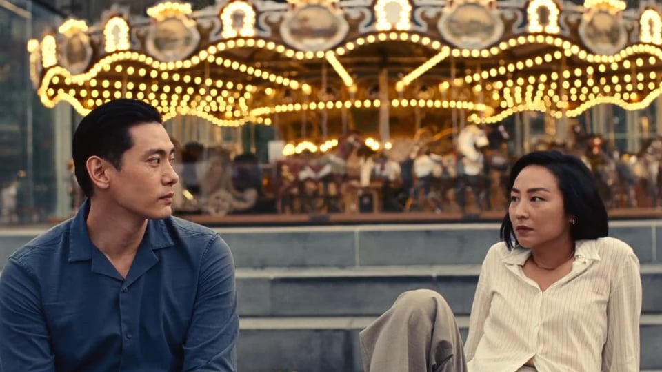 Image from the movie Past Lives; two people looking sad