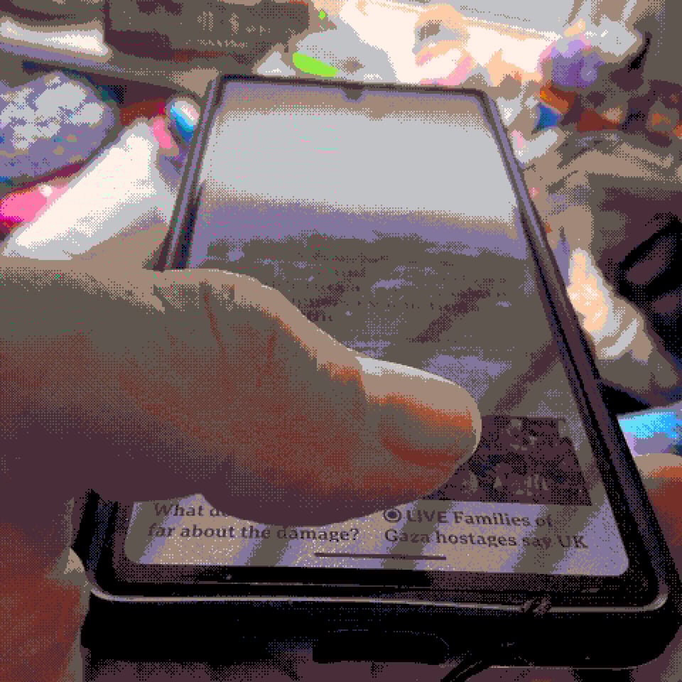 a pixelated image of a thumb on a phone screen