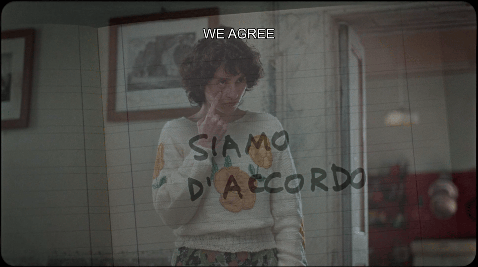 A woman showing the Italian gesture for "we agree"