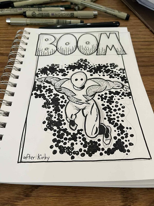 A spiral bound book of drawing paper lies open, revealing a drawing of Lightning Man, unfinished, surrounded by Kirby Krackle. There are pens in the background.