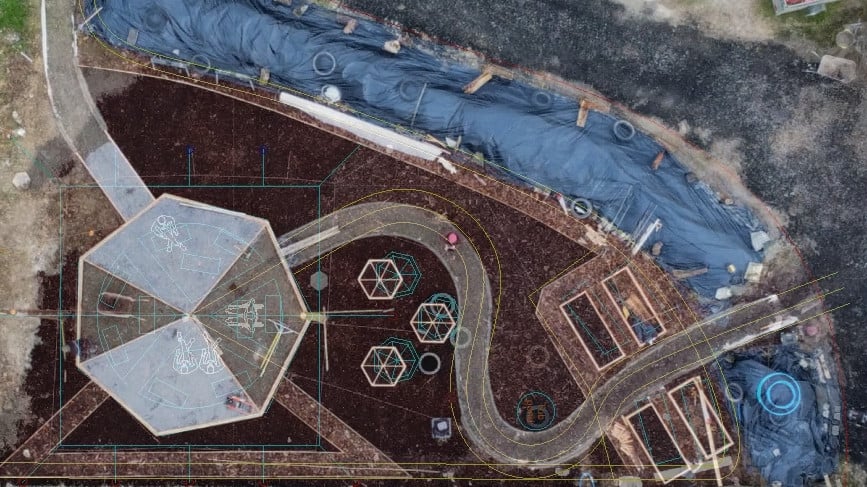 Drone shot of the finished paths overlaid with the original CAD design