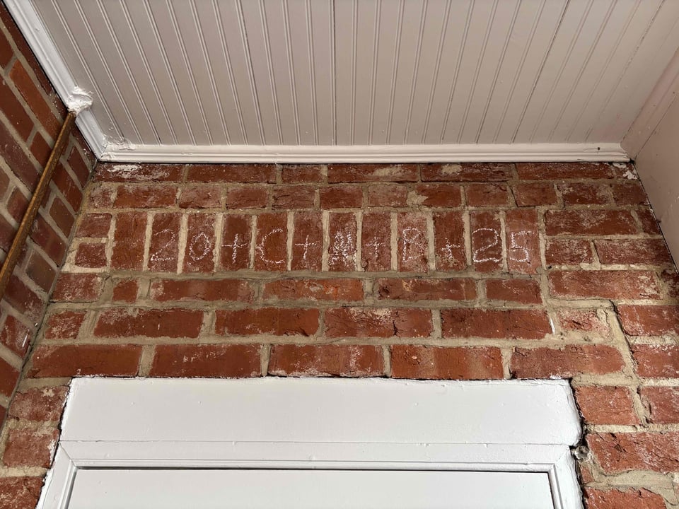 doorway with chalk blessing above it