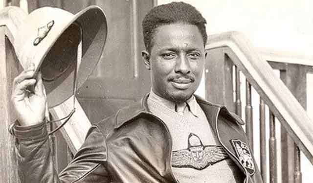 B&W image of Johnson looking a camera