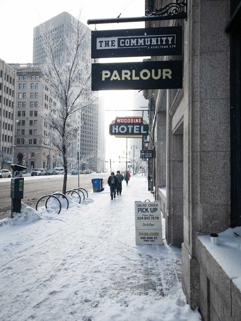 03 - Downtown Winnipeg sidewalk with snowy footsteps.jpg