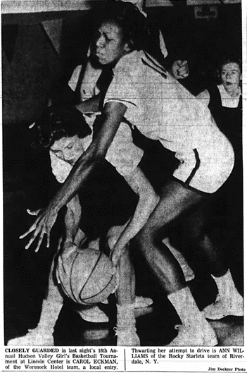 Newspaper clipping with photo of Carol Eckman being guarded closely by Ann Williams