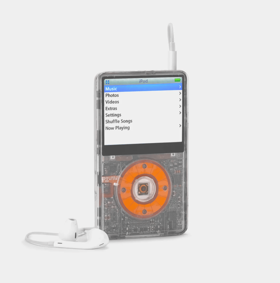 A vintage iPod with clear plastic casing.