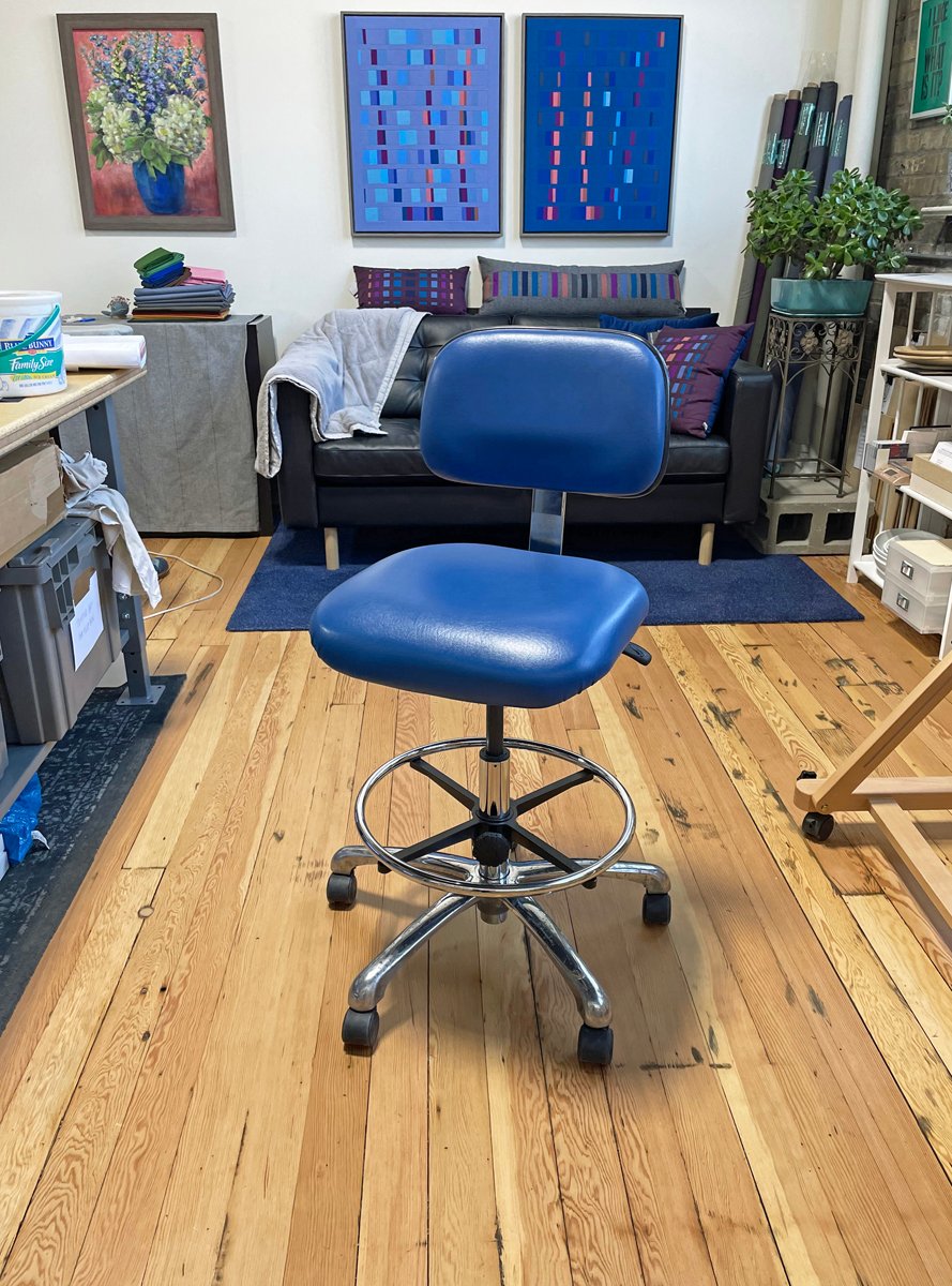 a blue chair in a room