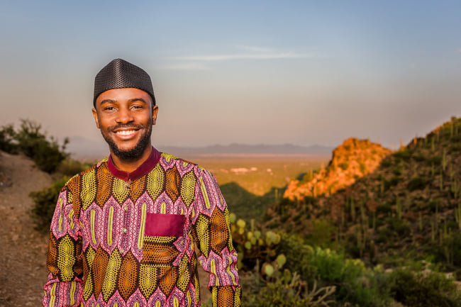 A photo of author Suyi Davies Okungbowa in the desert.