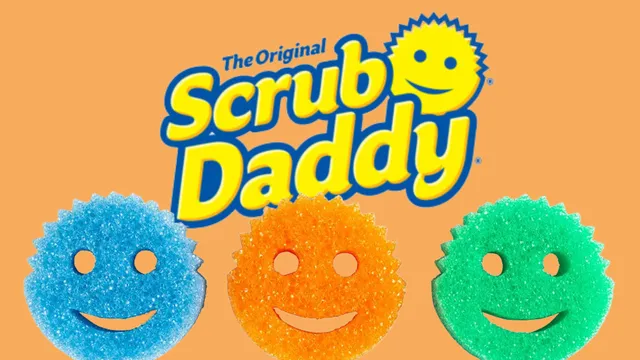 a smiley face with the words scrub daddy