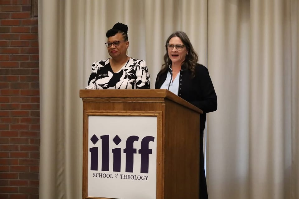 Dr. Jennifer McCurdy speaking at a podium