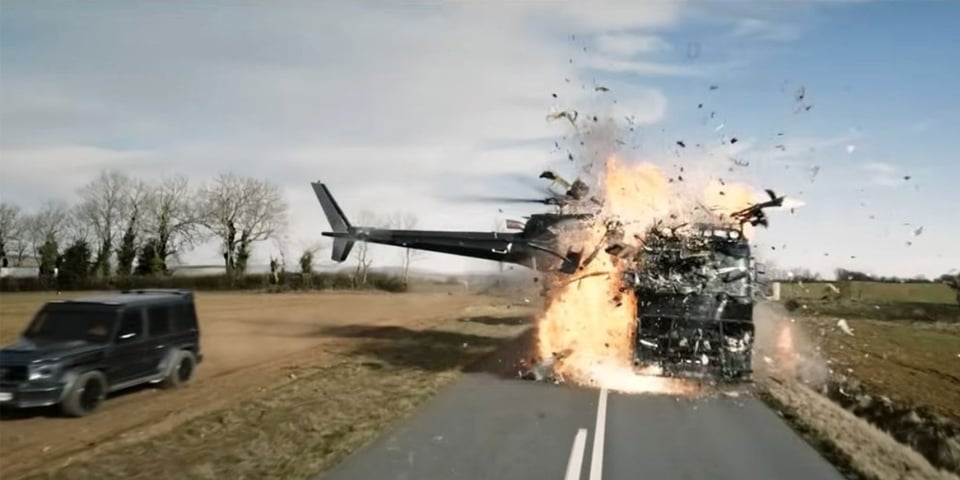 A helicopter explodes in mid-air after it crashes into a lorry.