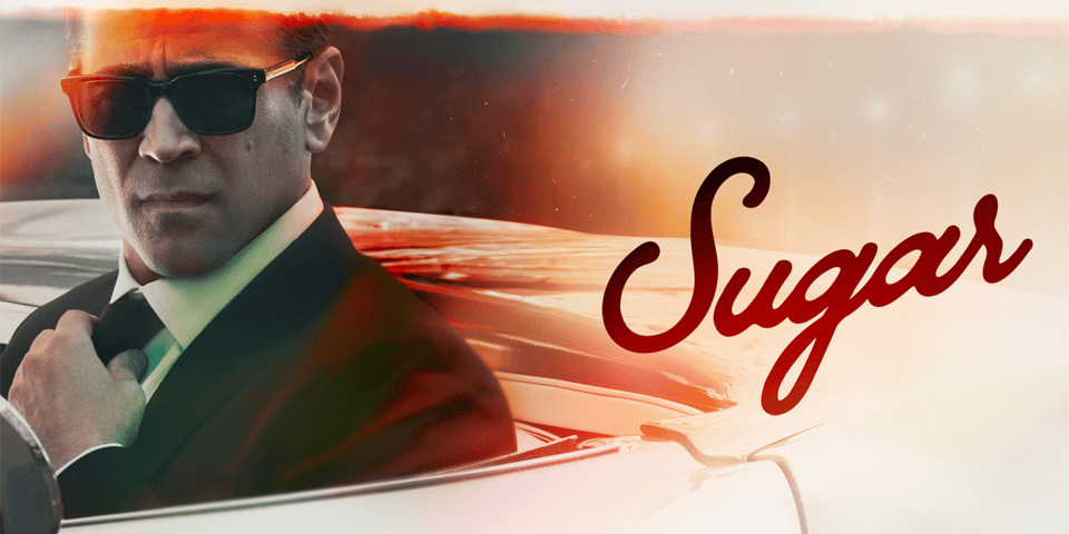 Colin Farrell straightens his tie.