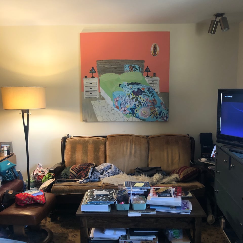 Portrait of a Lesbian Marriage painting hanging in a living room