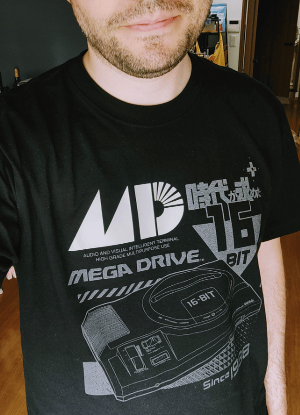 Black t-shirt with Sega Mega Drive graphics in gray and white ink