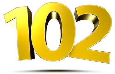 The number “102” in a gold, balloony, cartoony font, with a shadow on the “floor” underneath it.