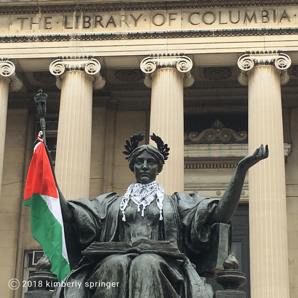 a statue in front of the library of columbia