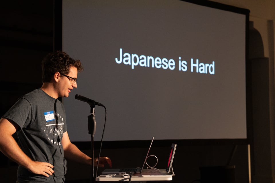 A man presenting about Japanese.