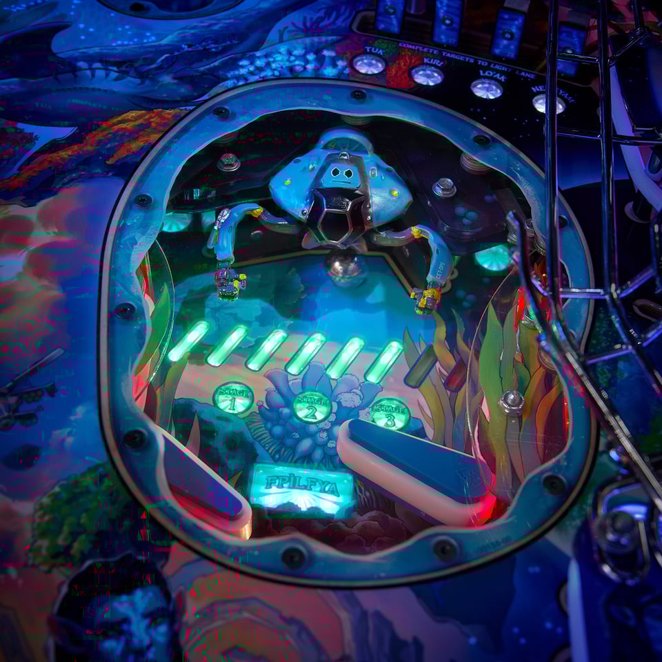 A smaller lower playfield on the new Avatar pinball table with two flippers and a robotic kraken.