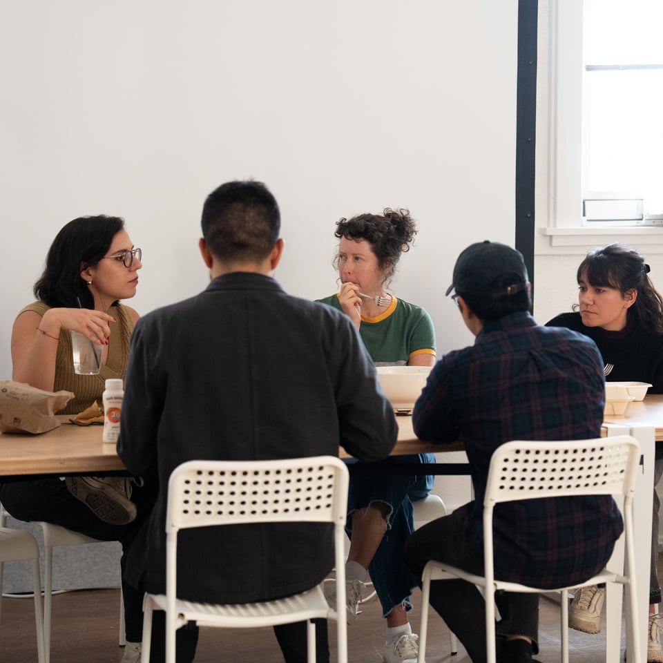 A group of people eating lunch together.
